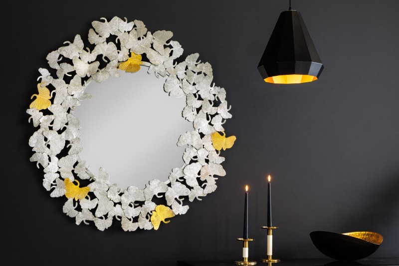 Levně Estila Designové glamour nástěnné zrcadlo Ginko s ozdobným kovovým rámem z listů ginka stříbrné barvy 95cm
