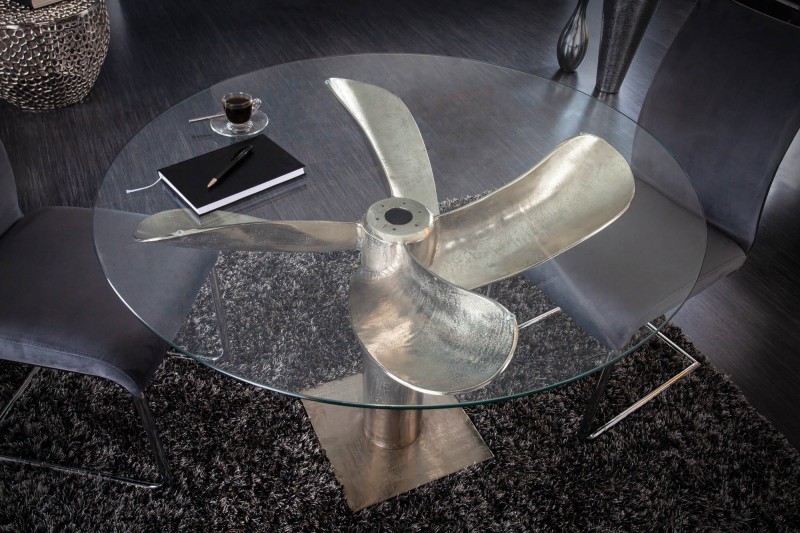 Estila Kulatý jídelní stůl z kovu a skla ve tvaru lodního šroubu ve stříbrném provedení s kulatou deskou ze skla 94cm