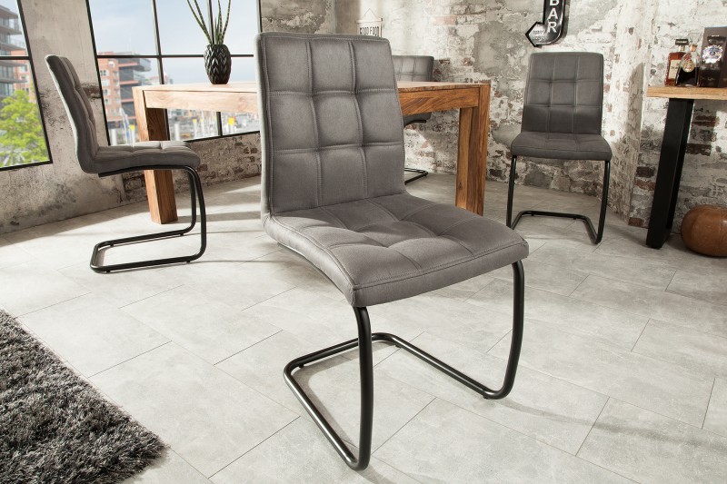 Estila Industriální jídelní židle Naomy s kovovou černou konstrukcí a čalouněným prošívaným sezením 92cm