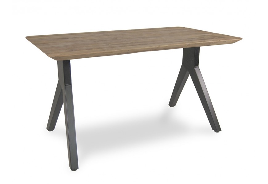 Luxusní moderní jídelní stůl Jersey s obdélníkovou deskou se zaoblenými rohy z masivního teakového dřeva v teplé hnědé barvě se dvěma nohama z kovu v černé barvě ve tvaru obráceného Y