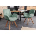 Designov&aacute; zelen&aacute; boucl&eacute; j&iacute;deln&iacute; židle Loris s n&iacute;zk&yacute;mi bočn&iacute;mi opěrkami a dubov&yacute;mi nožičkami 85 cm