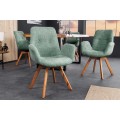 Designov&aacute; zelen&aacute; boucl&eacute; j&iacute;deln&iacute; židle Loris s n&iacute;zk&yacute;mi bočn&iacute;mi opěrkami a dubov&yacute;mi nožičkami 85 cm