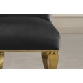 Designov&aacute; glamour j&iacute;deln&iacute; židle Gold Barock s kabriolov&yacute;mi nožičkami ve zlat&eacute; barvě a čern&yacute;m sametov&yacute;m potahem 105 cm
