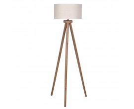 Masivn&iacute; venkovsk&aacute; stojac&iacute; lampa Ira se třemi nožičkami z mangov&eacute;ho dřeva v hněd&eacute; barvě s v&aacute;lcov&yacute;m kulat&yacute;m st&iacute;n&iacute;tkem z bavlny v b&eacute;žov&eacute; barvě