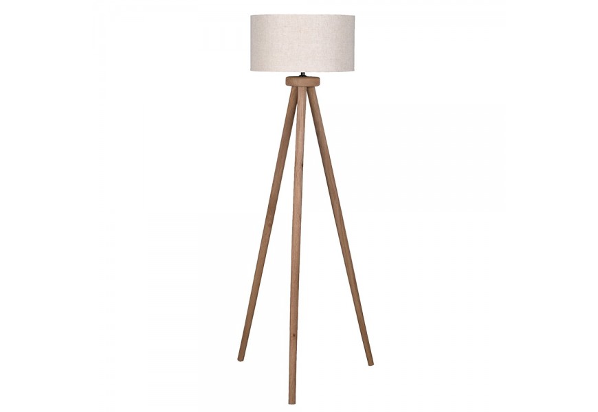 Masivní venkovská stojací lampa Ira se třemi nožičkami z mangového dřeva v hnědé barvě s válcovým kulatým stínítkem z bavlny v béžové barvě