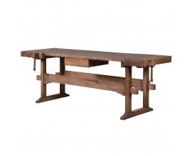 Vintage pracovn&iacute; stůl Guria v obd&eacute;ln&iacute;kov&eacute;m tvaru z masivn&iacute;ho recyklovan&eacute;ho dřeva v hněd&eacute; barvě se z&aacute;suvkou a dvěma truhl&aacute;řsk&yacute;mi svorkami