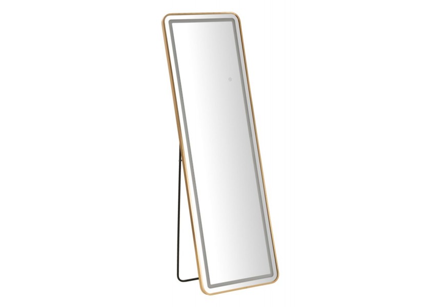 Designové art deco obdélníkové zrcadlo Leanor s rámem se zaoblenými rohy z kovu ve zlaté barvě s černým stojanem a LED pásem se třemi teplotami osvětlení