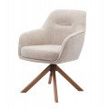 Designová moderní jídelní židle Egon s čalouněnou otočnou sedací částí s potahem s lněným designem ve světlé béžové barvě se čtyřmi šikmými nohami z masivního dubového dřeva v přírodní hnědé barvě