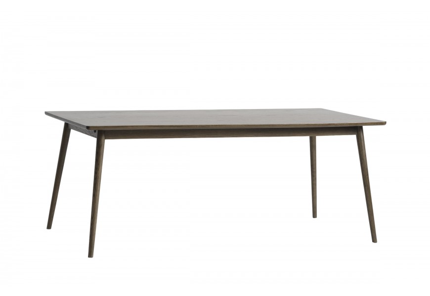 Designový skandinávský jídelní stůl Aarhus s rozkládací obdélníkovou vrchní deskou se zaoblenými rohy s válcovitými nožičkami se zúžením ve spodní části v tmavě hnědé barvě z dubového dřeva