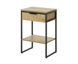 Modern&iacute; industri&aacute;ln&iacute; nočn&iacute; stolek Holstebro s obd&eacute;ln&iacute;kovou vrchn&iacute; deskou se z&aacute;suvkou a otevřenou polic&iacute; s dlouh&yacute;ma nohama v matn&eacute; čern&eacute; barvě z kovu a melaminovou d&yacute;hou se světl&yacute;m hněd&yacute;m dubov&yacute;m dekorem