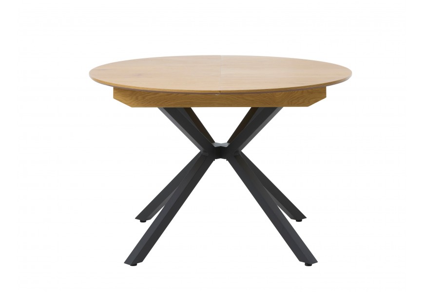 Industriální designový jídelní stůl Holstebro s kulatou rozkládací vrchní deskou ve světlém hnědém přírodním dubovém provedení s podstavou z kovu v černé barvě se čtyřmi zkříženýma nohama