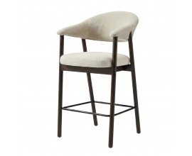 Skandin&aacute;vsk&aacute; barov&aacute; židle Bodil s žinylkov&yacute;m potahem v kr&eacute;mově b&iacute;l&eacute; barvě na sedadle a opěrce s dřevěn&yacute;m r&aacute;mem v př&iacute;rodn&iacute;m dubov&eacute;m tmav&eacute;m hněd&eacute;m proveden&iacute; s přiznanou kresbou letokruhů