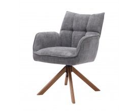 Modern&iacute; otočn&eacute; j&iacute;deln&iacute; křeslo Laerke s opěrkami na ruce s čalouněnou sedac&iacute; č&aacute;st&iacute; s žinylkov&yacute;m potahem v &scaron;ed&eacute; barvě s line&aacute;rn&iacute;m pro&scaron;&iacute;v&aacute;n&iacute;m na opěrce se čtyřmi &scaron;ikm&yacute;mi nohami z masivn&iacute;ho dubov&eacute;ho dřeva v př&iacute;rodn&iacute;m hněd&eacute;m proveden&iacute;