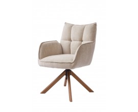 Modern&iacute; skandin&aacute;vsk&eacute; j&iacute;deln&iacute; křeslo Laerke s otočnou čalouněnou sedac&iacute; č&aacute;st&iacute; s žinylkov&yacute;m potahem v b&eacute;žov&eacute;m lněn&eacute;m odst&iacute;nu s pro&scaron;&iacute;v&aacute;n&iacute;m s obd&eacute;ln&iacute;kov&yacute;m vzorem s opěrkami na ruce s podstavou se čtyřmi &scaron;ikm&yacute;mi nohami v př&iacute;rodn&iacute;m hněd&eacute;m dubov&eacute;m proveden&iacute;