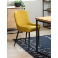Designov&aacute; modern&iacute; j&iacute;deln&iacute; židle Shariq s bukl&eacute; potahem ve žlut&eacute; barvě a čern&yacute;ma kovov&yacute;mi nohama 82 cm