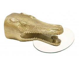 Modern&iacute; art deco kulat&yacute; př&iacute;ručn&iacute; z&aacute;věsn&yacute; stolek Crocodile s krokod&yacute;l&iacute; hlavou a &scaron;upinami ve zlat&eacute; barvě se transparentn&iacute; skleněnou deskou