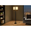 Modern&iacute; stojac&iacute; lampa Ambient s ov&aacute;ln&yacute;m světl&yacute;m textiln&iacute;m st&iacute;n&iacute;tkem a černou kovovou konstrukc&iacute; s podstavou 160 cm 