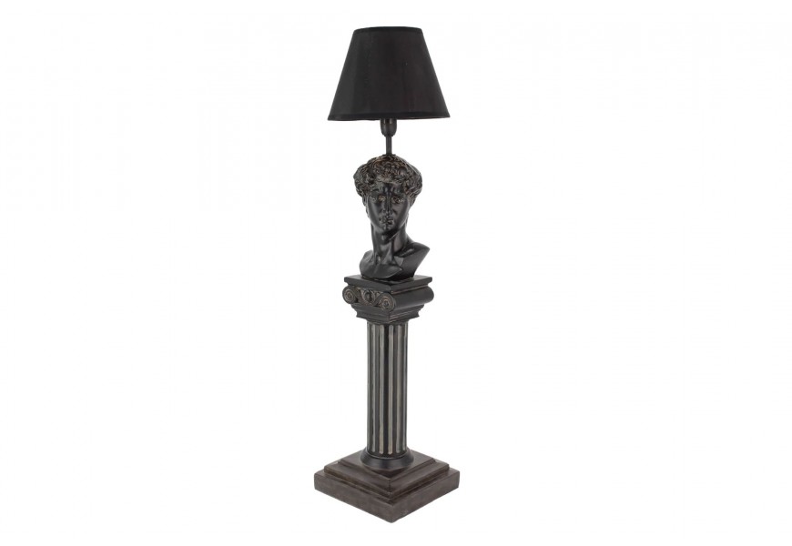 Designová stolní lampa Antica v černé barvě s vintage starožitnou patinou s nohou ve tvaru antického sloupu s drážkováním a ozdobnou hlavicí s Michelangelovou bustou Davida s válcovitým stínítkem z textilu s rozšířenou spodní částí