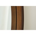 Designov&eacute; modern&iacute; kulat&eacute; n&aacute;stěnn&eacute; zrcadlo Auri s dřevěn&yacute;m r&aacute;mem v ořechov&eacute;m hněd&eacute;m proveden&iacute; 70 cm