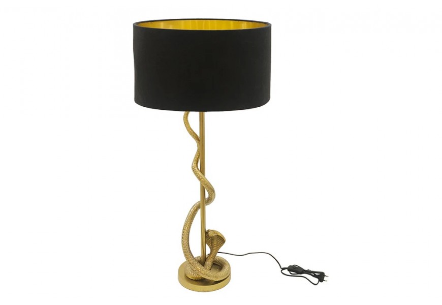 Art deco zlatá stolní lampa Tierra Glam s kovovou konstrukcí se štíhlou nohou obtočenou dekorativním prvkem ve tvaru hada s kulatým podstavcem a kulatým stínítkem s příměsí bavlny v černé barvě
