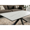 Modern&iacute; obd&eacute;ln&iacute;kov&yacute; keramick&yacute; konferenčn&iacute; stolek Ceramia Blanca s designem b&iacute;l&eacute;ho mramoru s překř&iacute;žen&yacute;ma čern&yacute;ma nohama 100 cm