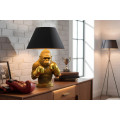 Designov&aacute; glamour stoln&iacute; lampa Pop Atelier se zlatou podstavou se sochou opice s boxersk&yacute;mi rukavicemi a čern&yacute;m st&iacute;n&iacute;tkem 55 cm