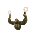 Designov&aacute; glamour n&aacute;stěnn&aacute; lampa Tierra Glam s designem opice se dvěma ž&aacute;rovkami ve zlat&eacute; barvě 50 cm