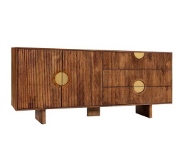 Designov&yacute; art deco obd&eacute;ln&iacute;kov&yacute; př&iacute;born&iacute;k Tores z masivn&iacute;ho mangov&eacute;ho dřeva v př&iacute;rodn&iacute; hněd&eacute; barvě s dvoudveřovou skř&iacute;ňkou a dvěma z&aacute;suvkami s asymetricky um&iacute;stěn&yacute;mi kulat&yacute;mi &uacute;chytkami a žebrovan&yacute;m reli&eacute;fem ve zlat&eacute; barvě se třemi ploch&yacute;mi &scaron;irok&yacute;mi nohama