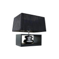 Designová glamour obdélníková stolní lampa Galla se stínítkem z organzy s proužkovaným vzorem v černé barvě s designovou profilovanou nohou v lesklém stříbrném provedení a obdélníkovém černém dřevěném rámu