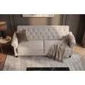 Designov&aacute; chesterfield rozkl&aacute;dac&iacute; sedačka Maison Belle Affaire pro tři osoby s b&eacute;žov&yacute;m bukl&eacute; potahem 220 cm