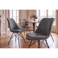 Designov&aacute; retro j&iacute;deln&iacute; židle Scandinavia s &scaron;ed&yacute;m žinylkov&yacute;m potahem a čern&yacute;m kovov&yacute;m nohama 50 cm