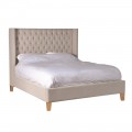 Luxusní postel Heidy II s béžovým lněným čalouněním ve stylu Chesterfield a nohama z borovicového dřeva 162cm