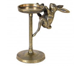 Vintage mosazn&yacute; stojan na sv&iacute;čku Rabbit z kovu ve zlat&eacute; barvě s tmavou starožitnou patinou v kulat&eacute;m tvaru s jednou nohou s dekorac&iacute; v podobě figury zaj&iacute;ce