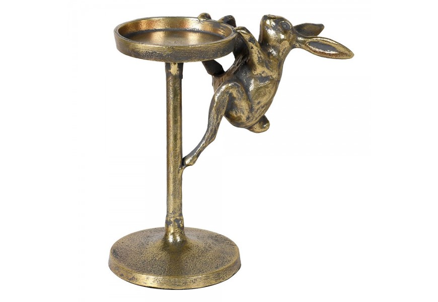 Vintage mosazný stojan na svíčku Rabbit z kovu ve zlaté barvě s tmavou starožitnou patinou v kulatém tvaru s jednou nohou s dekorací v podobě figury zajíce