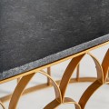 Art-deco mramorový konferenční stolek Amuny s tmavě šedou mramorovou deskou a zlatou konstrukcí