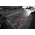 Industriální rozkládací keramický jídelní stůl Infinidad s obdélníkovým sklem překrytou povrchovou deskou 180-225cm