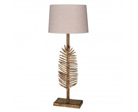 Art deco kovová zlatá stolní lampa Scoty s exotickou aplikací ve formě palmového listu na tyčové podstavě s kulatým stínítkem v béžové barvě