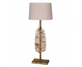 Art deco kovová zlatá stolní lampa Scoty s exotickou aplikací ve formě palmového listu na tyčové podstavě s kulatým stínítkem v béžové barvě