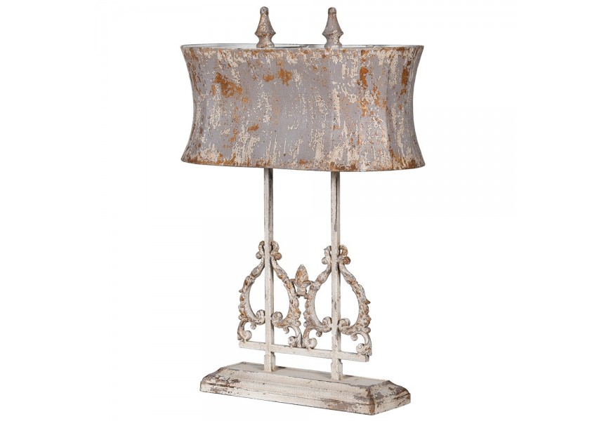 Starožitně působící ornamentálně zdobená oválná lampa Silvertongue s obdélníkovou podstavou šedé holubičí a slonovinové bílé barvy ve vintage stylu