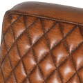 Hnědé kožené křeslo Serhy z pravé kůže s černou kovovou konstrukcí s retro vzorovaným čalouněním 89cm