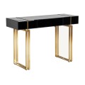 Art-deco konzolový stolek Bynum černý se skleněnou stolovou deskou a nožičkami ve zlatém kovovém provedení