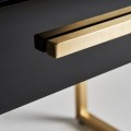 Moderní černý noční stolek Flara ve skleněném art-deco provedení se šuplíkem a kovovými nožičkami ve zlaté barvě 51cm