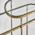 Art-deco set oválných konzolových stolků Amuny se skleněnou deskou a kovovou konstrukcí ve zlaté barvě 91cm