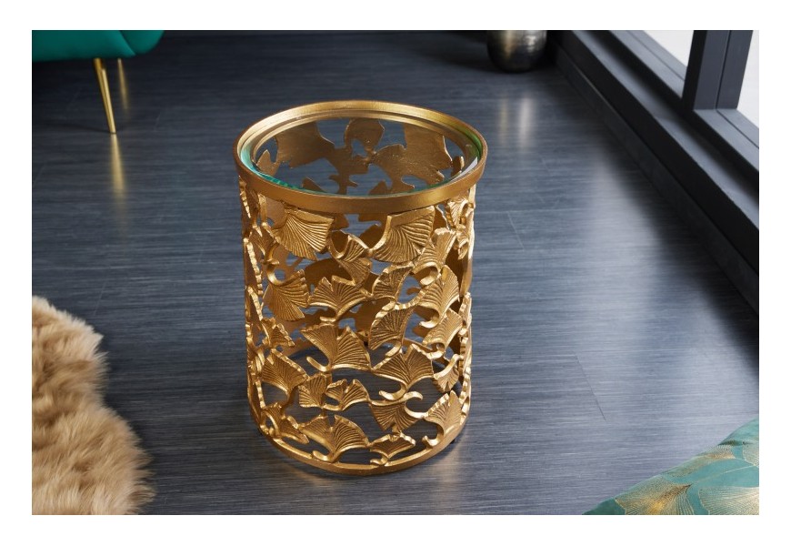 Elegantní art deco příruční stolek Ginko ve zlatém provedení z kovu se skleněnou povrchovou deskou kulatého tvaru