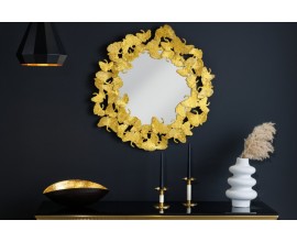 Luxusní zlaté nástěnné zrcadlo Ginko s kulatým kovovým rámem ve tvaru listů ginka ve stylu glamour