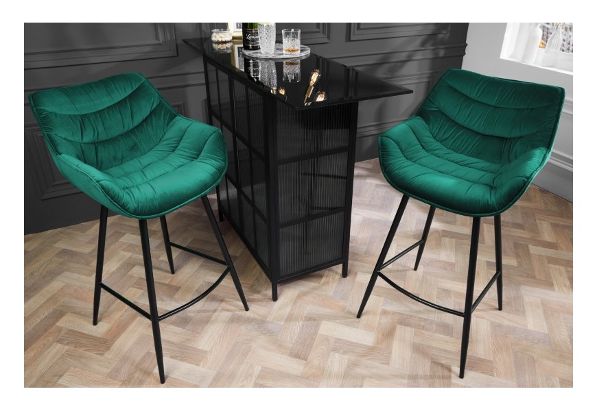 Designová industriální barová židle Kotor s černou kovovou konstrukcí a sametovým smaragdovozelným čalouněním