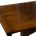 Jídelní stůl Terrel z dubového dřeva v masivním hnědém provedení s vyřezávanými nožičkami v rustikálním stylu s lesklým povrchem