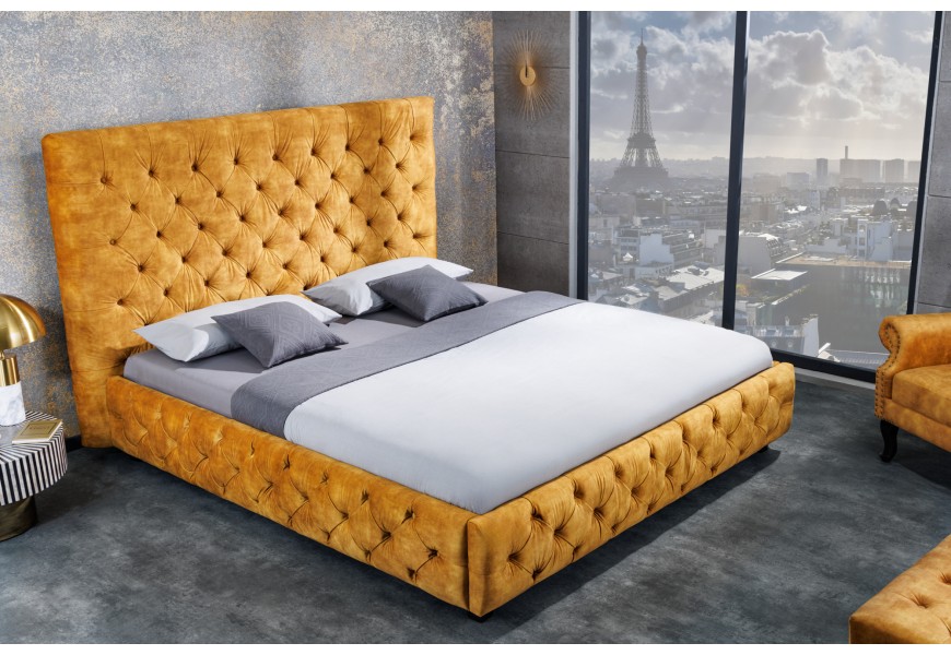 Stylová nadčasová manželská postel Kreon ve žlutém provedení se sametovým potahon