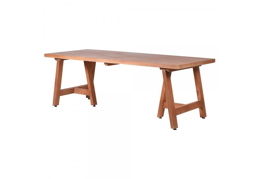 Masivní světle hnědý jídelní stůl s geometricky tvarovanými nožičkami z přírodního masivního dřeva