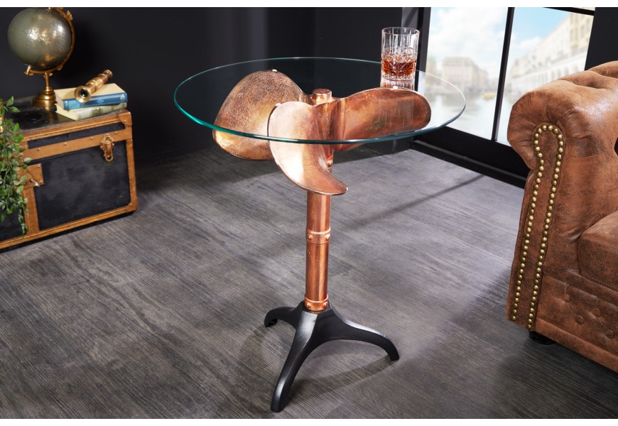 Kulatý příruční stolek Helice v koloniálním stylu s nohou s designem lodního šroubu v měděné barvě s černou podstavou a s vrchní deskou z bezpečnostního skla